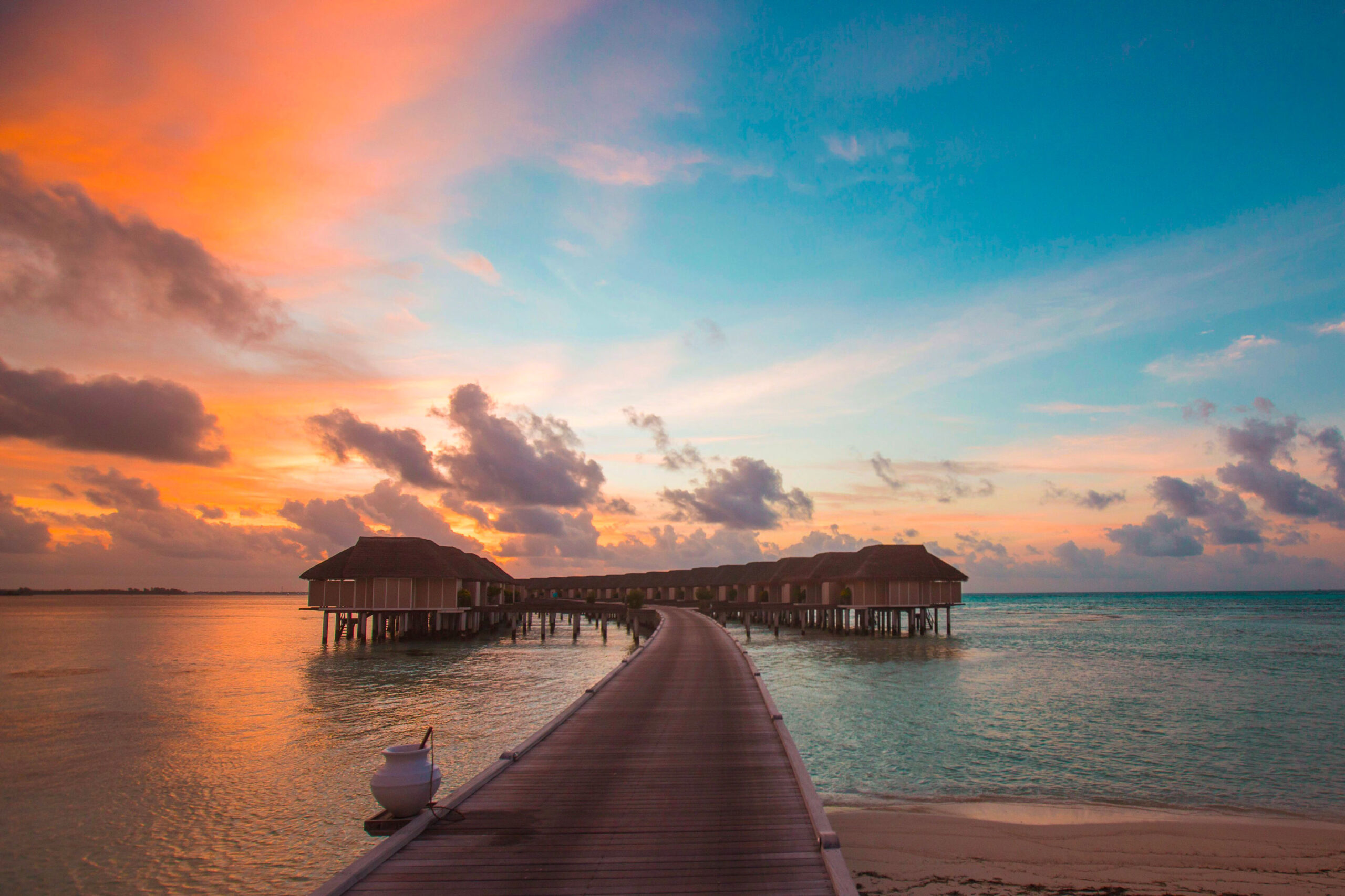 Stunning view of maldives huts at sunset
